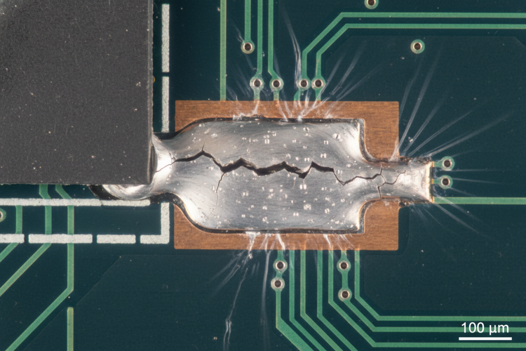 Cracked solder joint due to CTE mismatch under a microscope