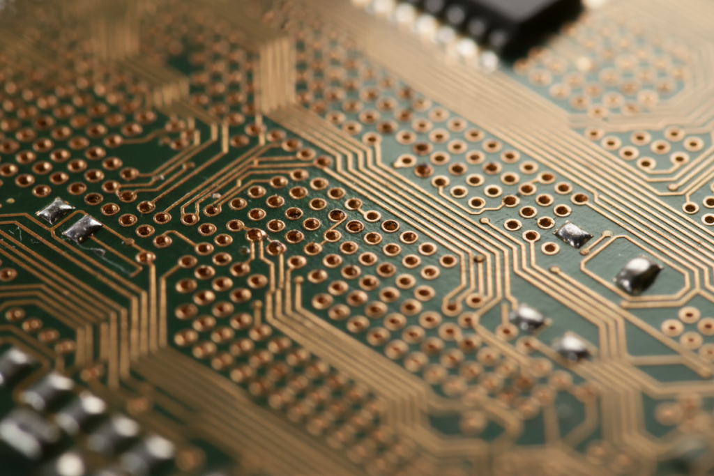 Macro view of an HDI PCB showing dense microvias and fine copper traces