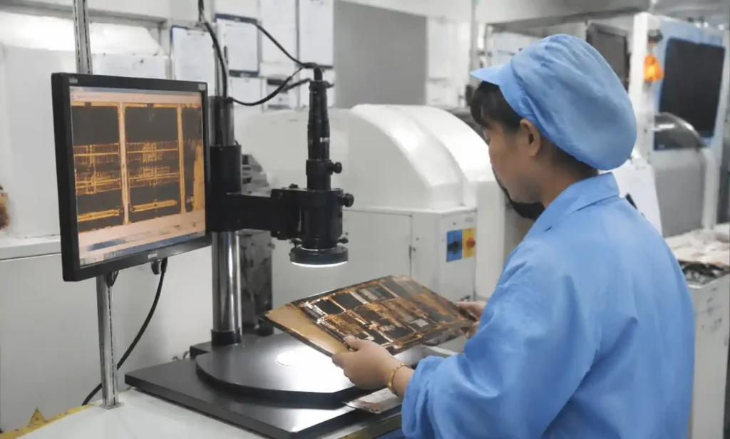Quality inspection and testing of rigid-flex PCB showing measurement equipmen