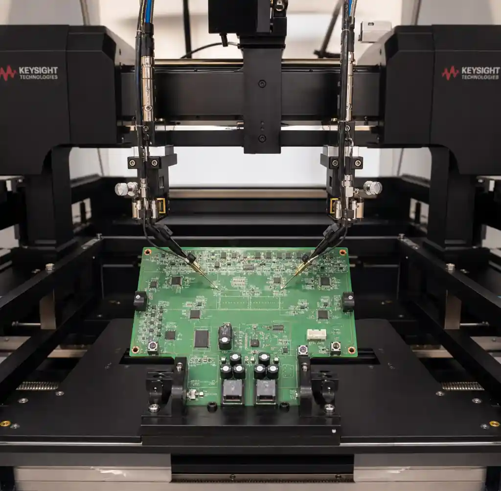 Flying probe tester with motorized probes contacting test pads on a bare or populated PCB