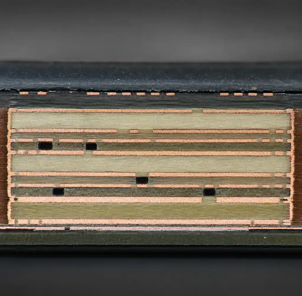 Cross-section of multilayer BMS PCB showing copper layers, ground planes, and signal layer stackup for isolation