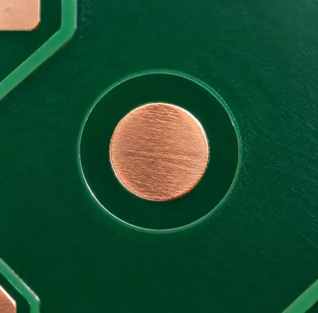 PCB fiducial mark showing 1mm copper pad with 2mm solder mask opening