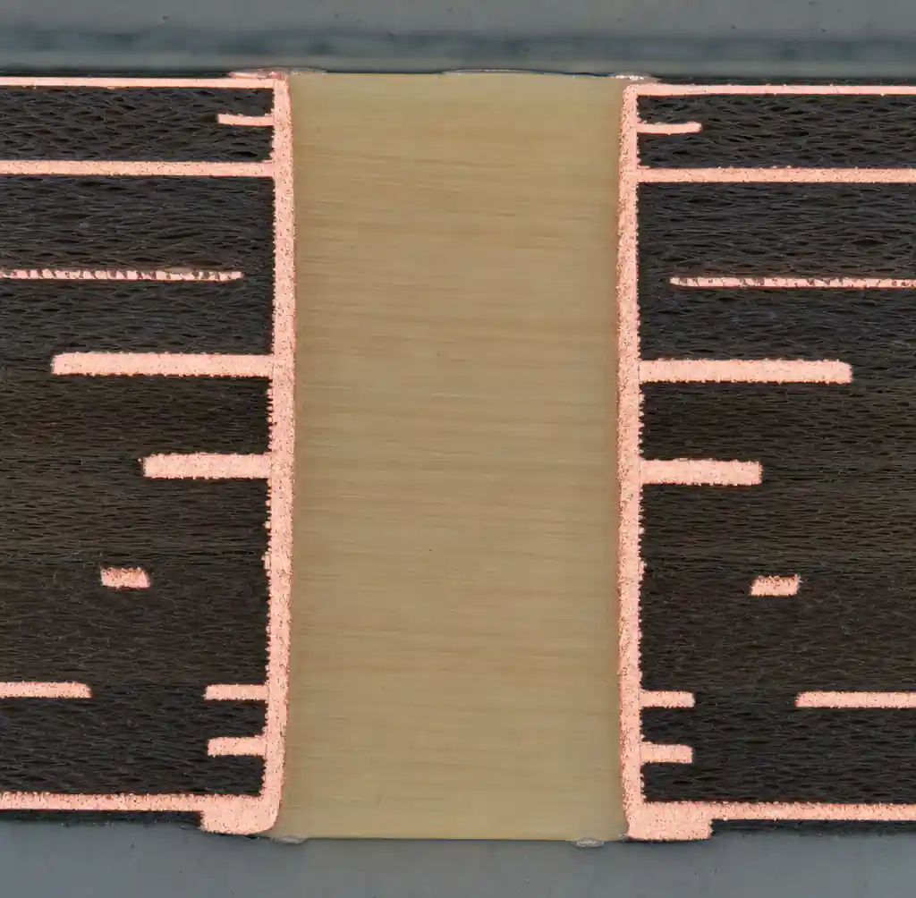 Cross-section of resin-plugged via showing epoxy fill and planarization