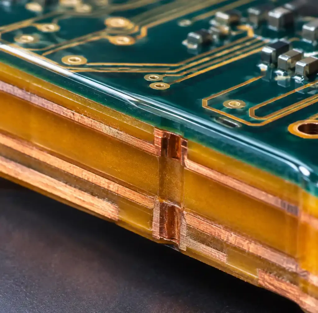 Close-up of space-grade PCB substrate materials showing polyimide layers and low-outgassing coating