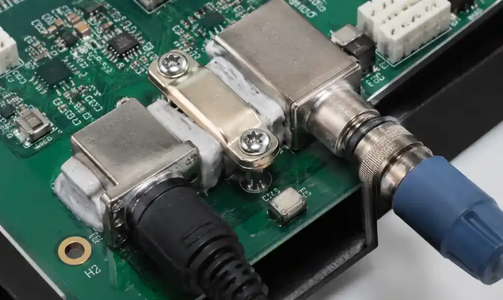 Connector strain relief with epoxy staking on industrial PCB
