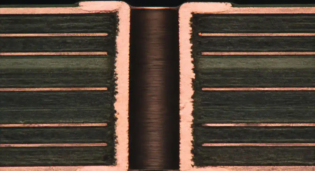 Microscopic cross-section of PCB showing annular ring and via barrel fill per IPC-6012 Class 3 standards