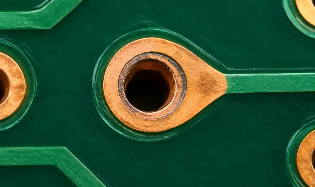 PCB showing drilling offset with teardrop providing annular ring margin