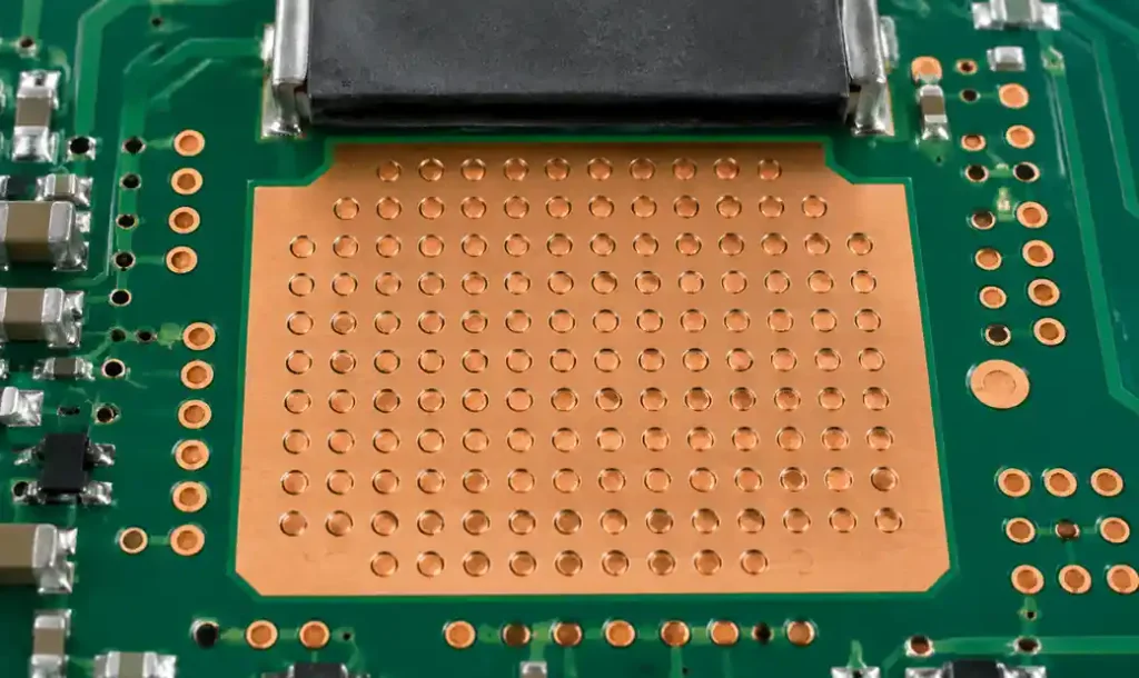 Copper-filled conductive vias for thermal management under power component