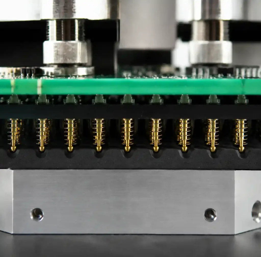 Test fixture showing elastomer backing for uniform force distribution