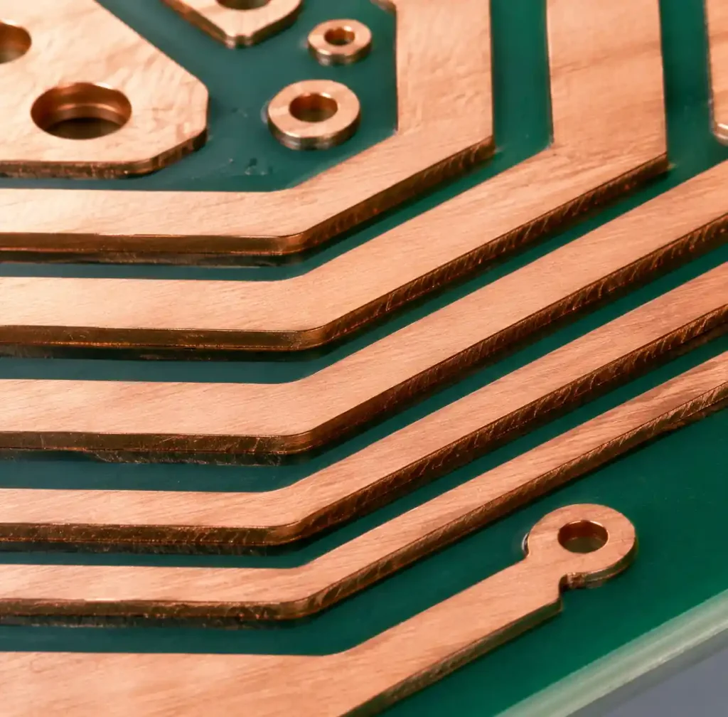 Heavy copper PCB etching process showing trace formation