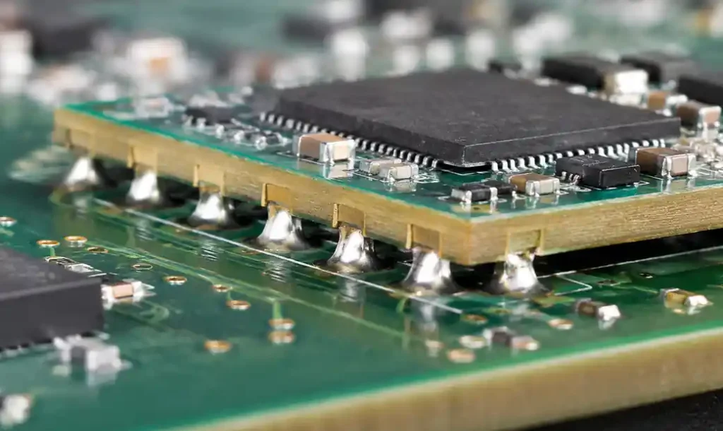 Assembled PCB module with castellated holes showing solder fillet formation
