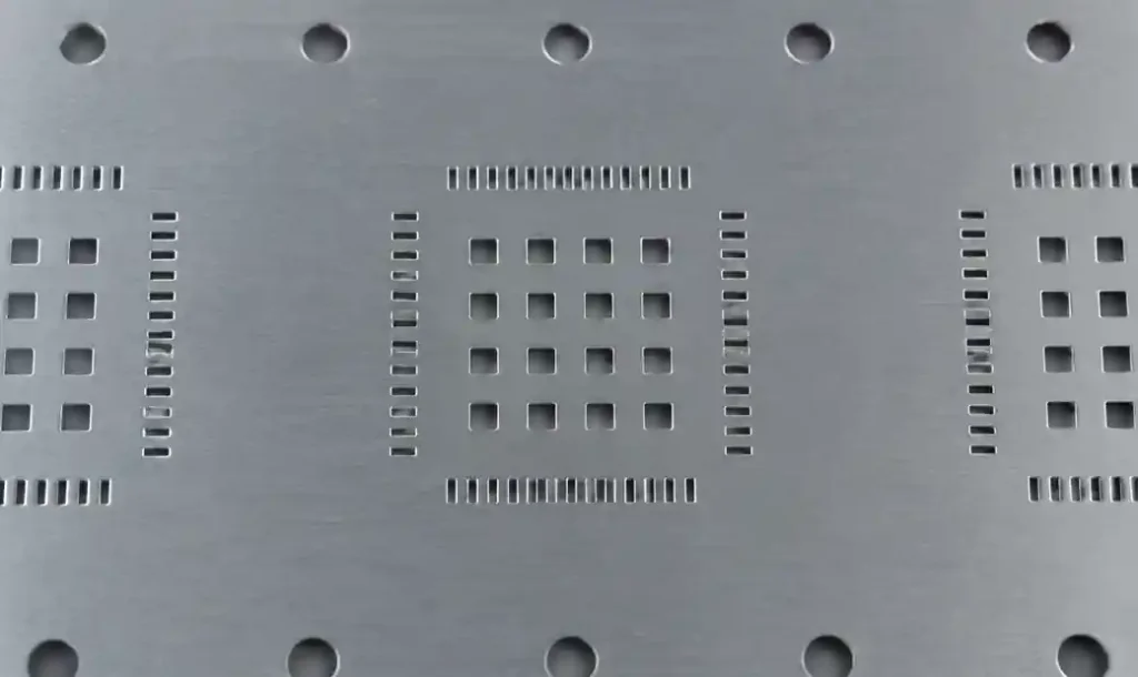 QFN thermal pad stencil aperture windowing pattern showing multiple smaller openings