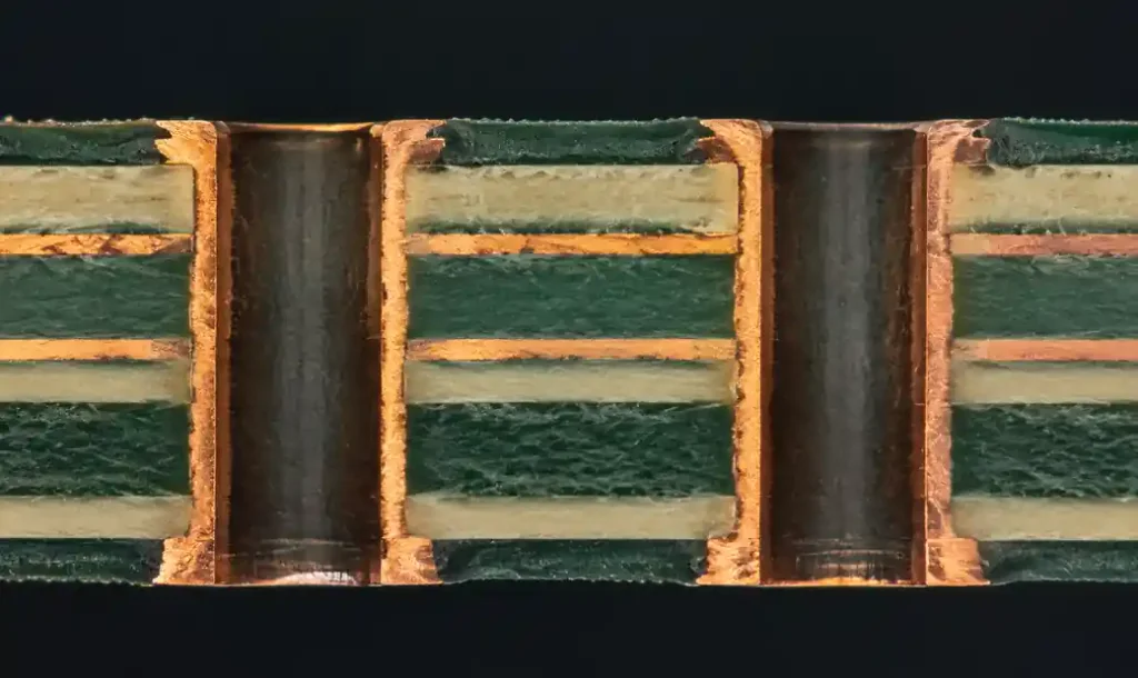 Cross-section showing castellated hole plating and routing accuracy