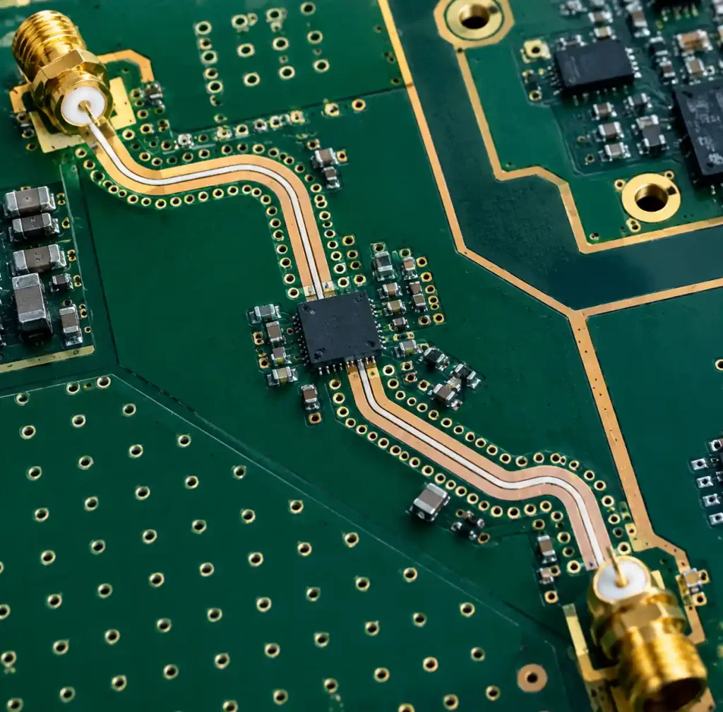 PCB layout showing via fencing and ground stitching pattern around RF traces for EMI control